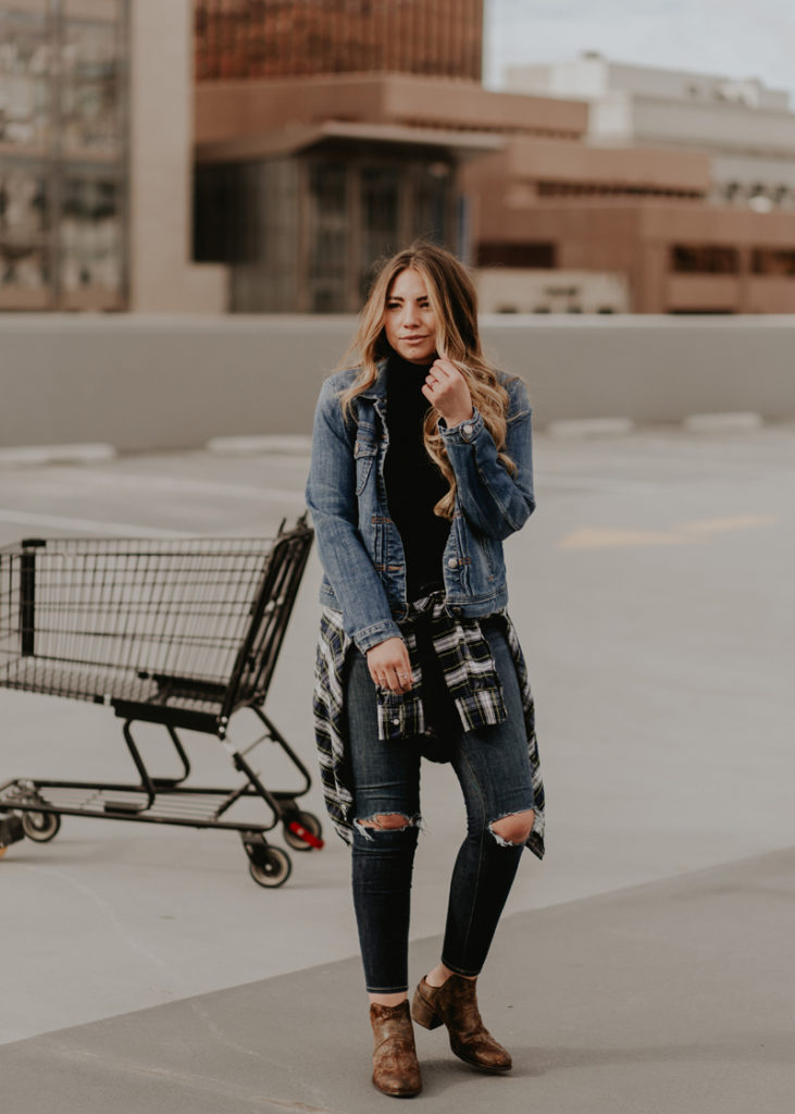 Lauryncakes, style blogger, wearing jeans and a jean jacket in a parking lot of Downtown Salt Lake City
