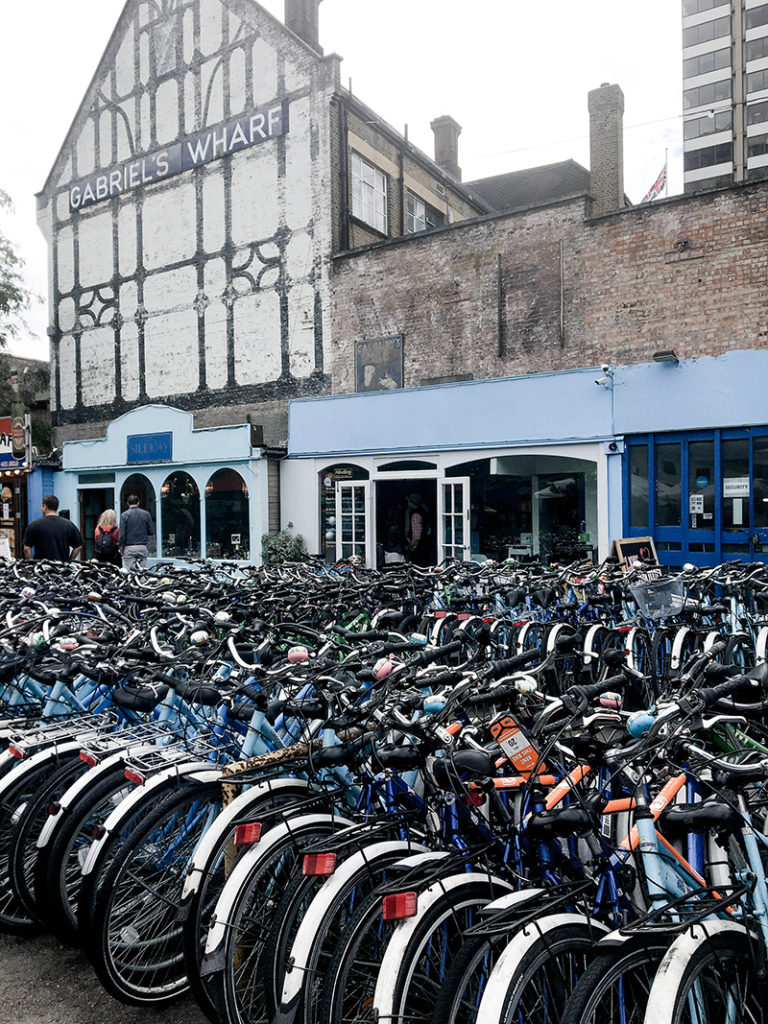 Tour bikes lined up outside shop at Gabriel's Wharf, London. 