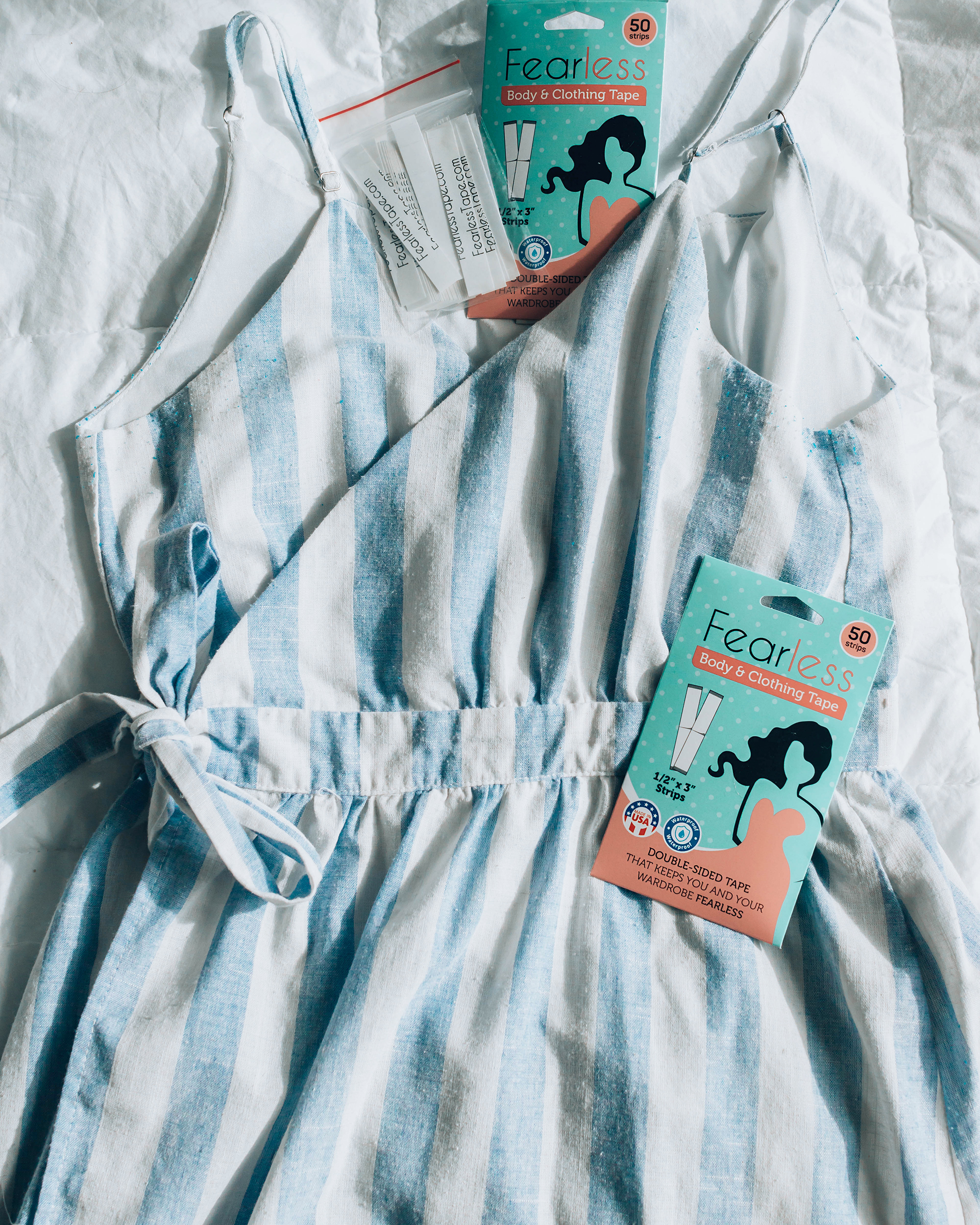 Fearless Tape package flatlay with striped dress