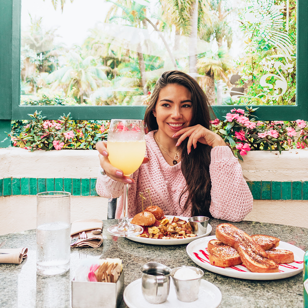 Lauryn Hock eats Brunch in San Diego, California and toasts a mimosa