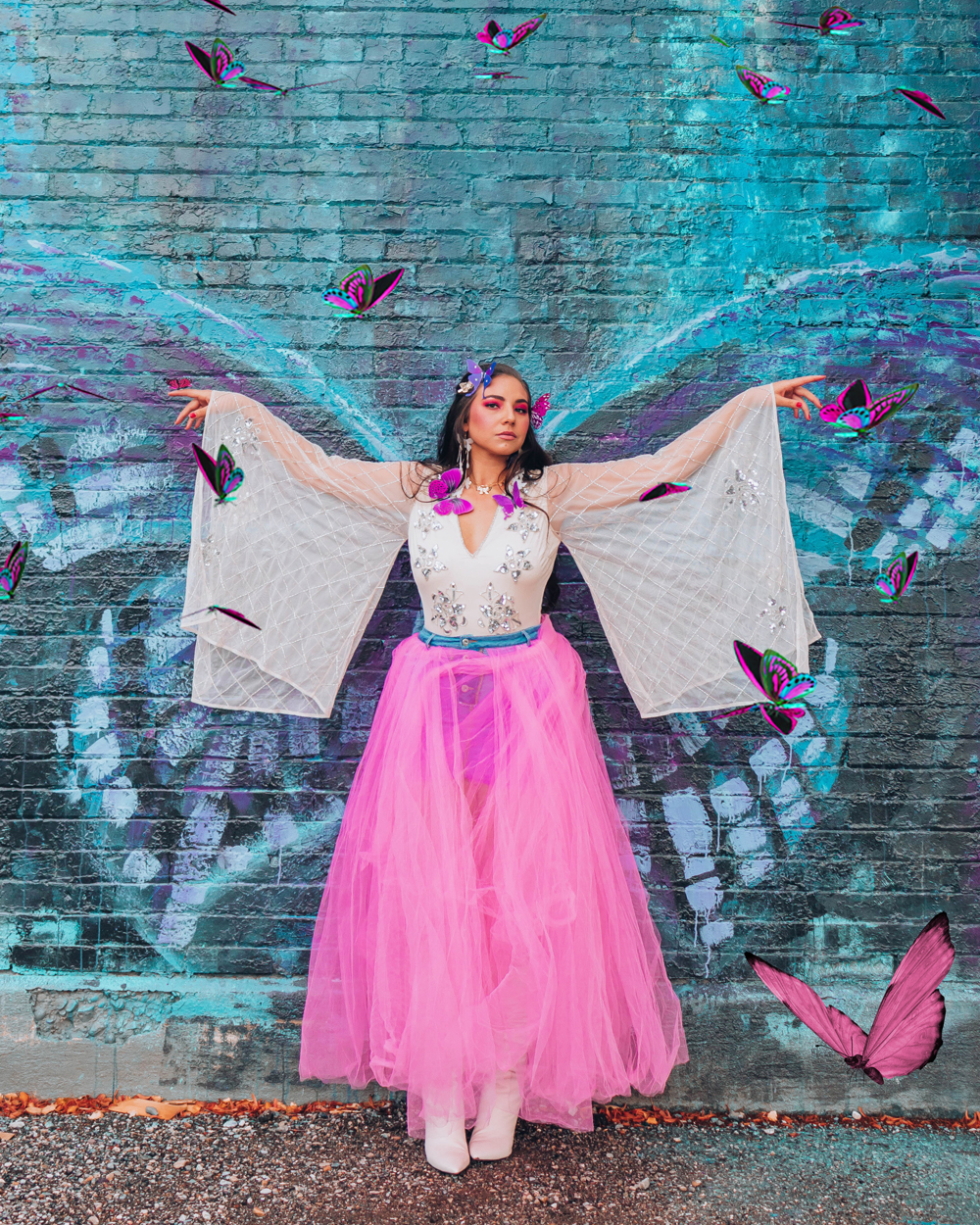 Lauryn hock became a beautiful pink and white butterfly for a DIY costume for Halloween