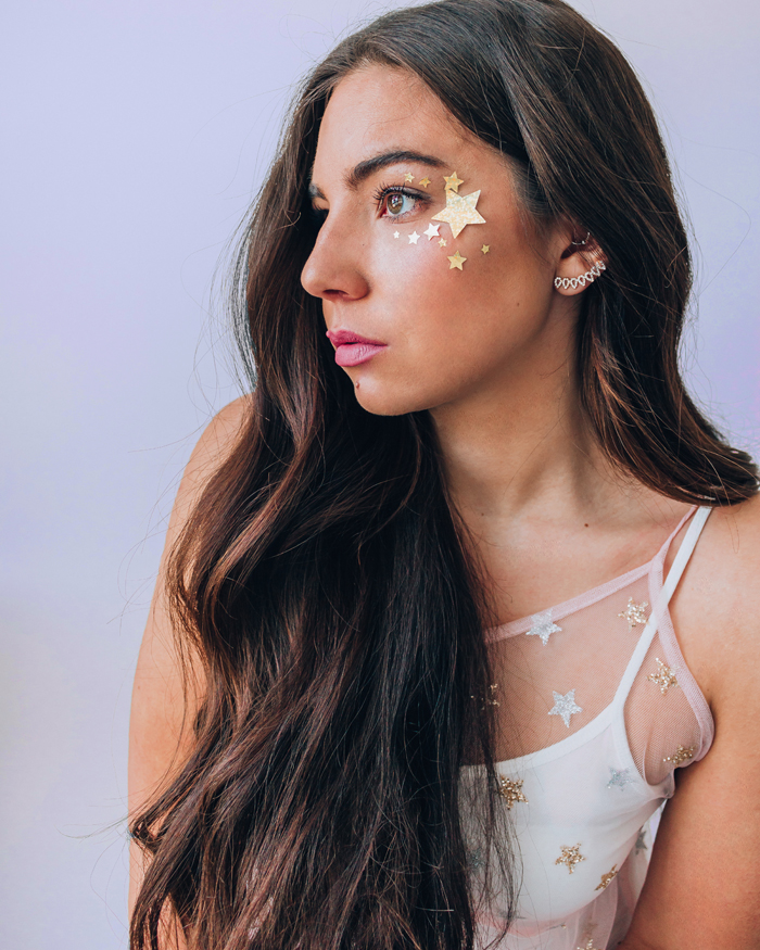 Lauryn Hock shows her side profile with stars on her face