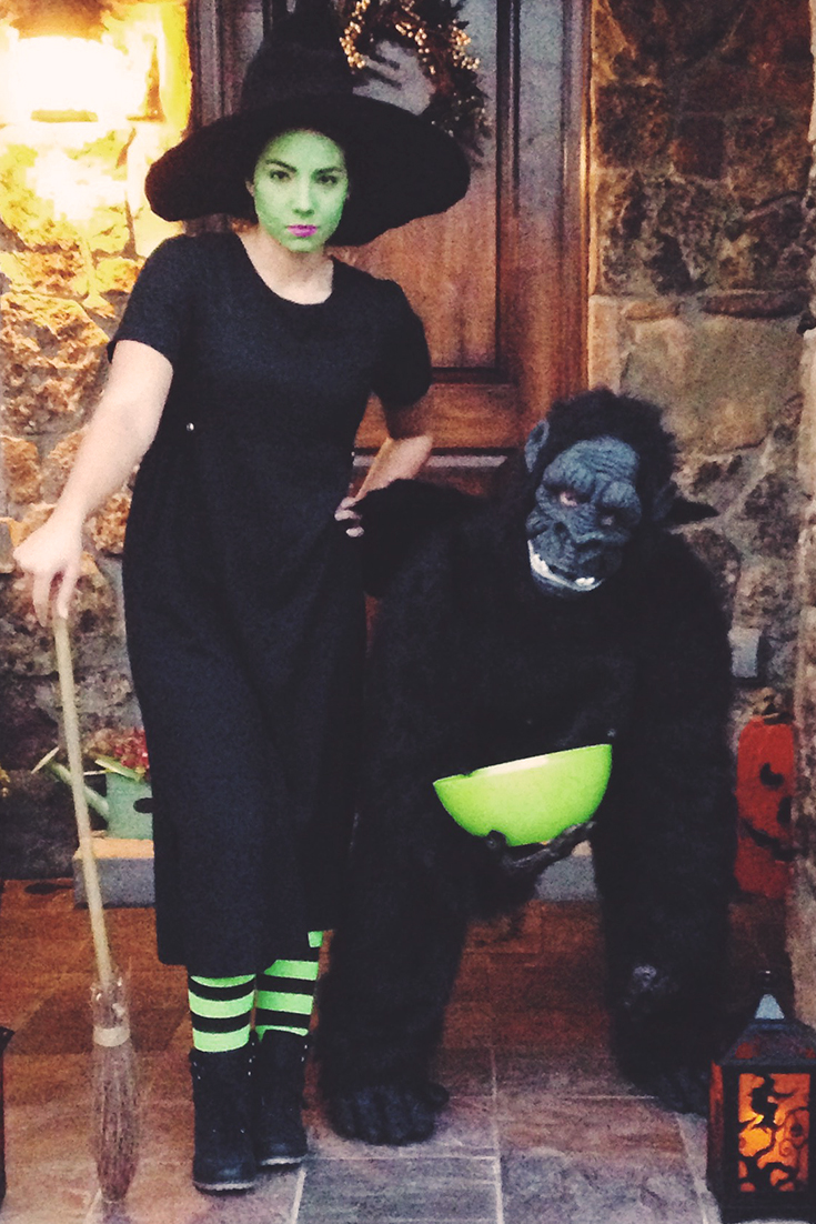 wizard of oz halloween wicked witch of the west standing next to a flying monkey gorilla suit