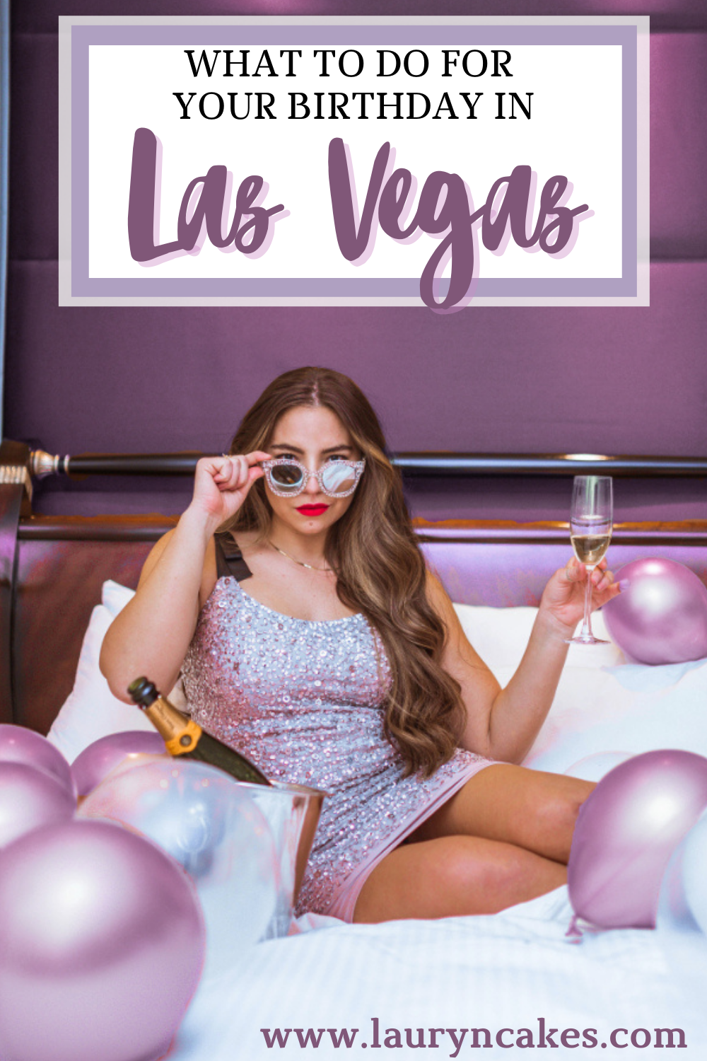 Lauryn Hock sitting on a bed holding a glass of champagne with balloons surrounding her. She's wearing a sparkly cocktail dress and peers over her sequin sunglasses while holding a glass. Text over the image says, "what to do for your birthday in vegas"
