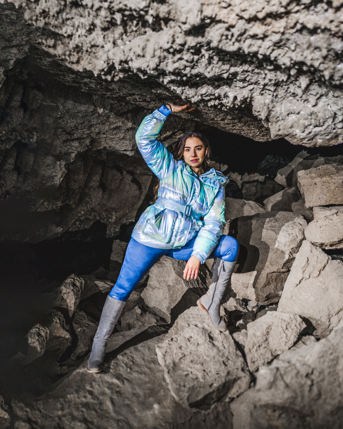 Travel blogger Lauryn Hock poses in Boyd Cave during a lava tube tour in Bend, Oregon