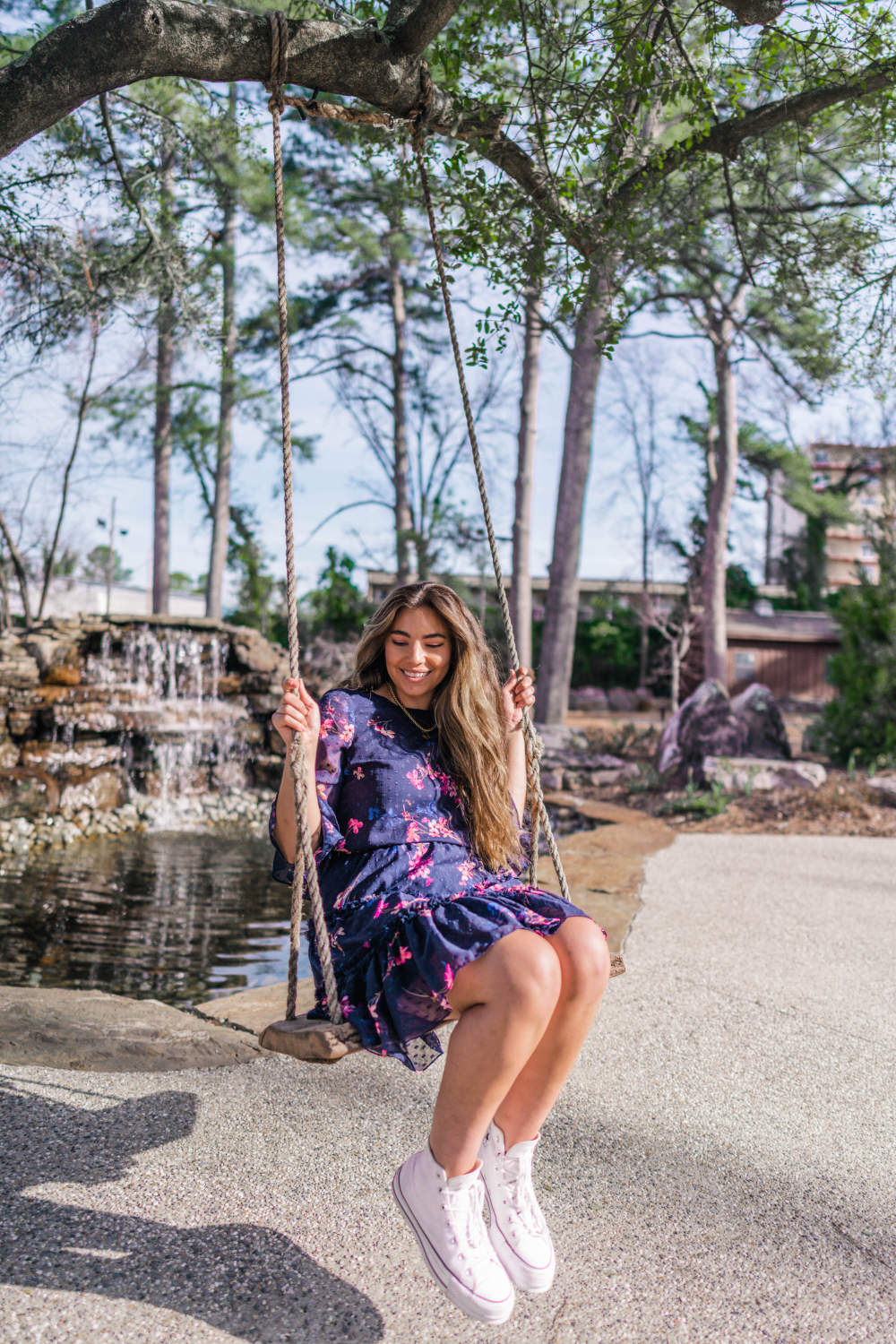 Lauyn Hock from Lauryncakes sitting on a swing at The Reserve Bed and Breakfast in a garden | 10 Hot Springs Arkansas Locations You Need To Visit