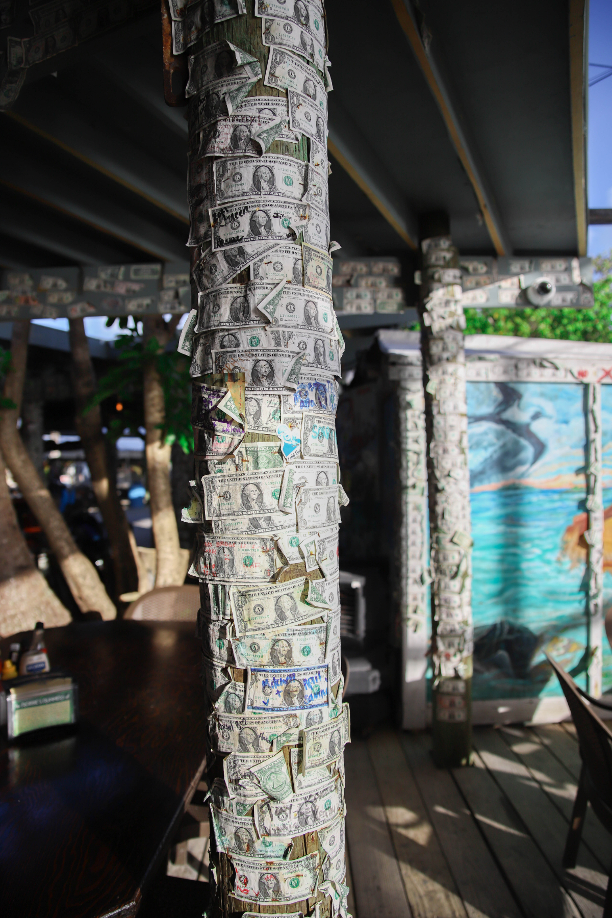 Robbie's of Islamorada restaurant and marina has poles with dollar bills signed and stapled on it