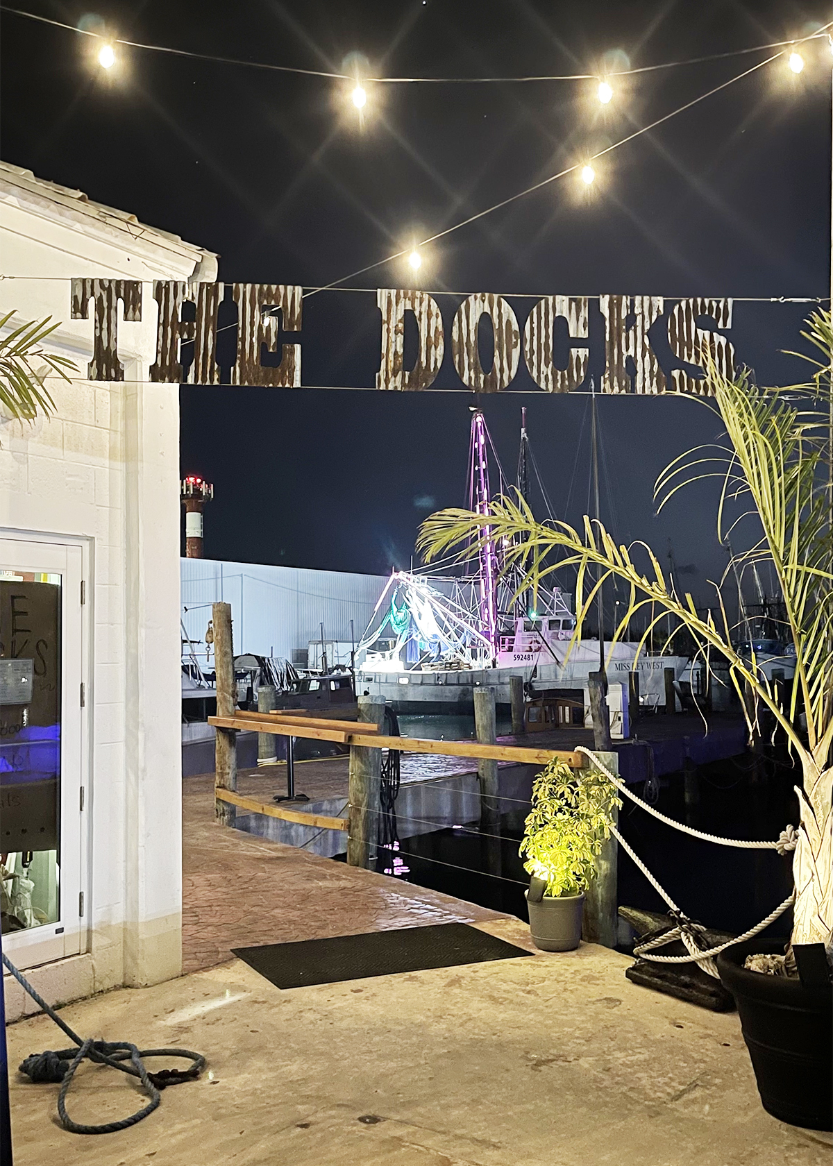 The Docks marquee sign at Stock island at the ocean docks at night